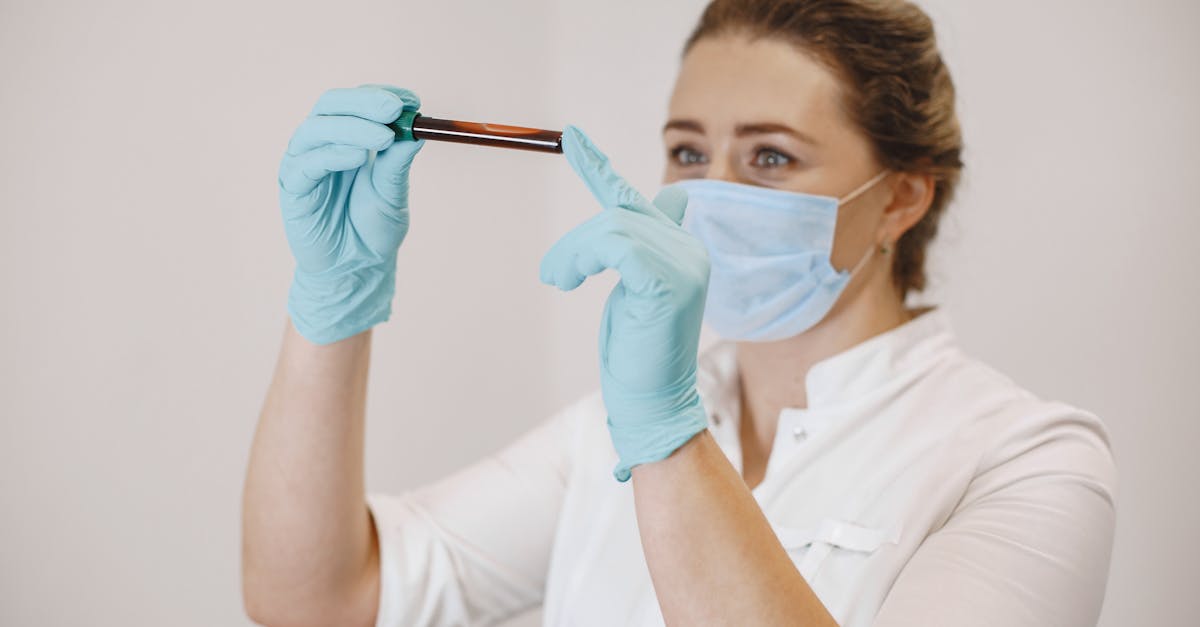 Medical professional handling blood sample vials