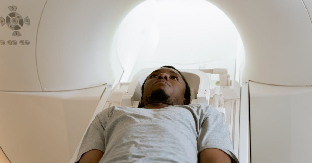 Patient being positioned inside a modern CT or MRI scanner