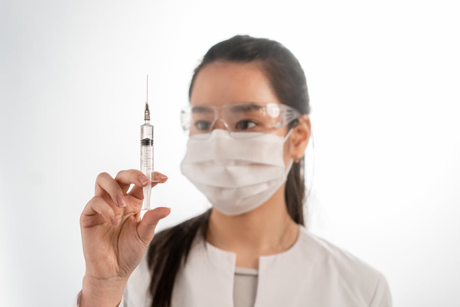 Asian female healthcare worker with vaccination equipment