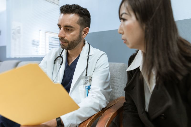 Doctor providing patient treatment at modern hospital