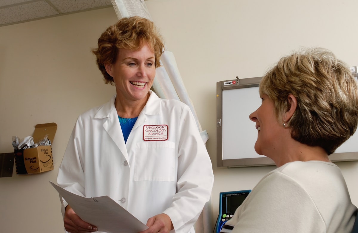 Doctor consulting with patient in hospital setting