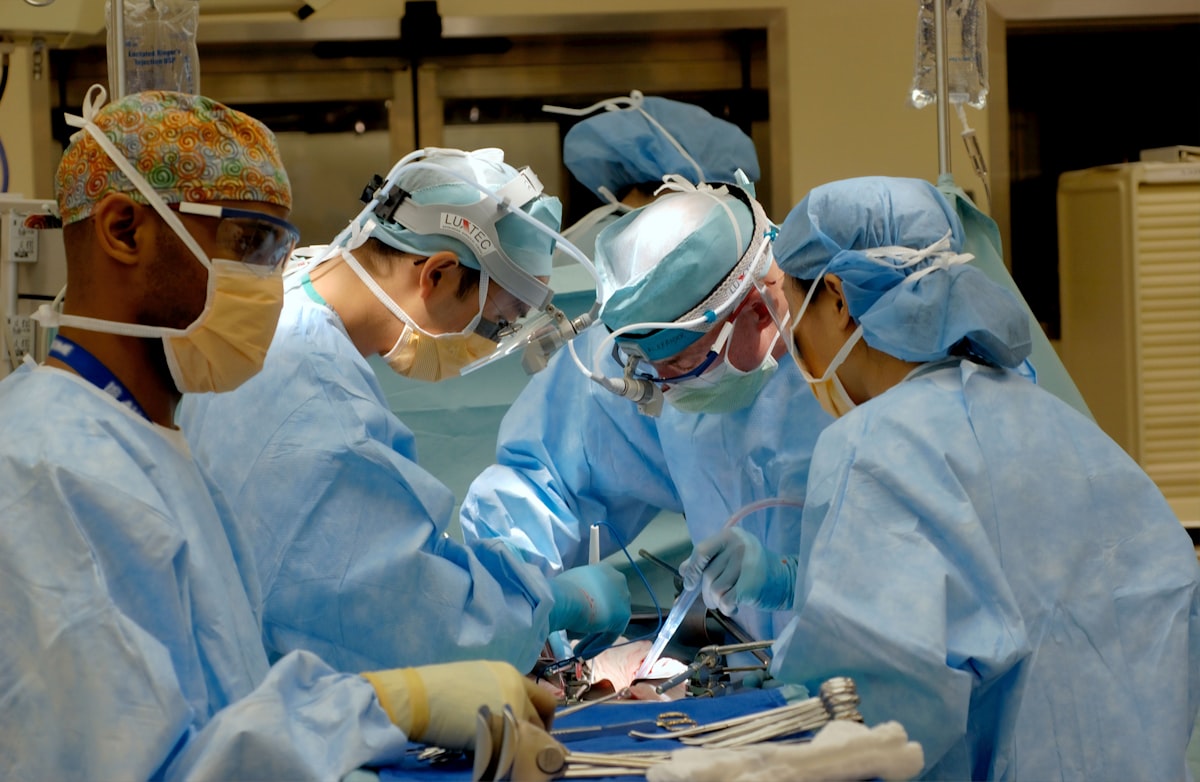 Doctors performing surgery in operating room