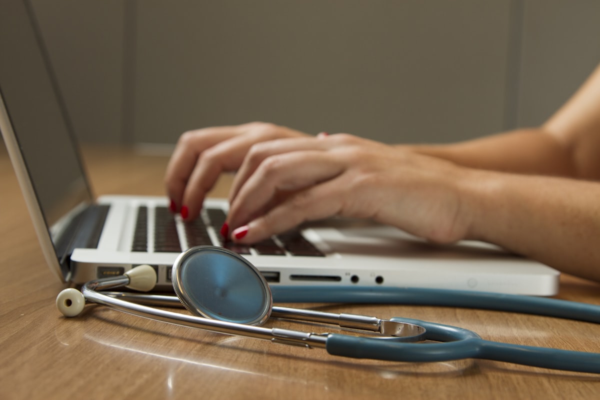 Doctor using digital technology and computer